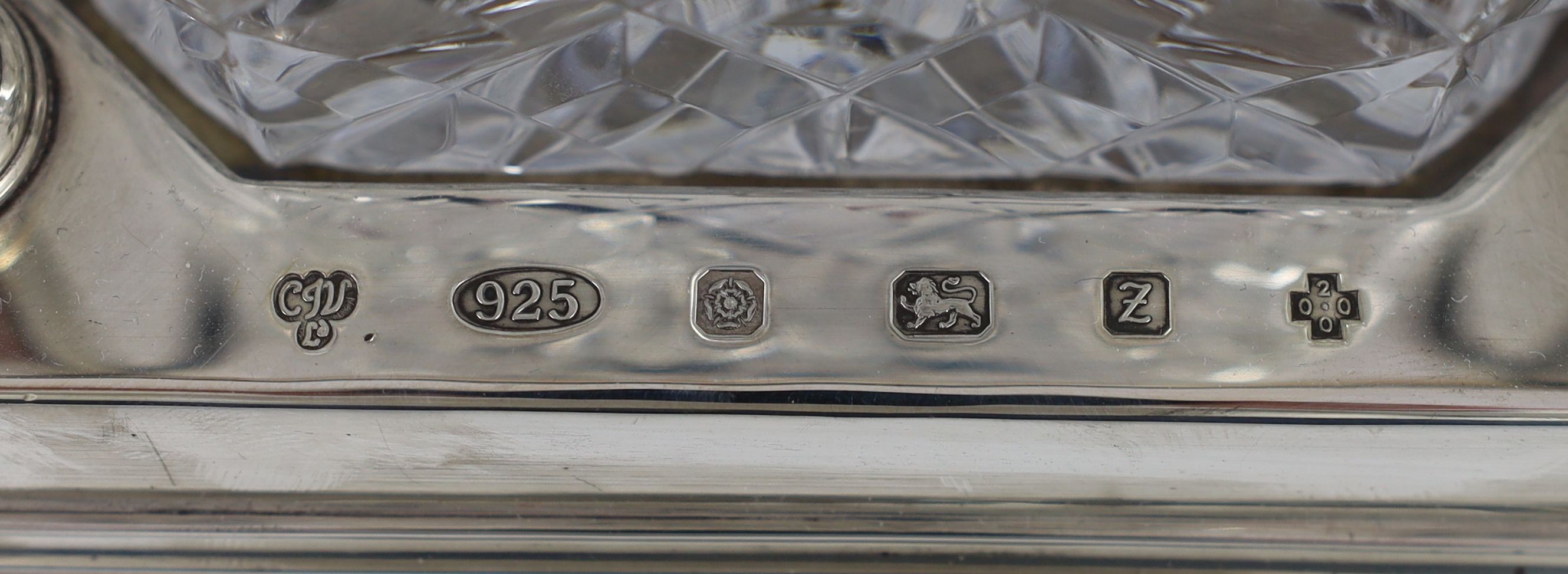A modern silver three bottle rectangular decanter stand, by C.J. Vander Ltd